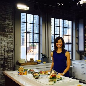 photo of Sue Mach in kitchen with healthy foods