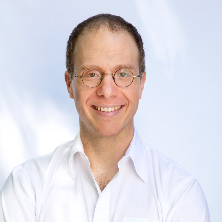 head shot, glasses, white collar shirt