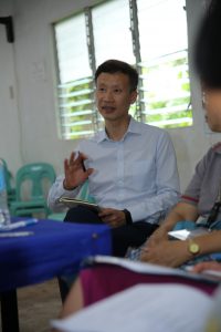 Prof. Xiaolin Wei speaks during a meeting in the Philippines. 