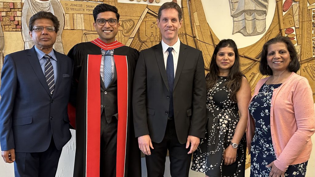 Doctoral Graduate Vaibhav Gupta poses with his supervisor and family after participating in DLSPH Hooding Ceremony.