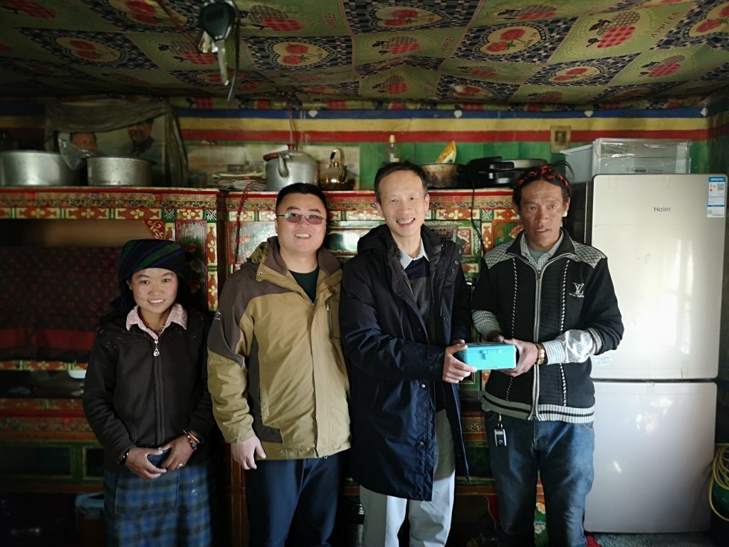 Professor Xiaolin Wei in Tibet with patients and village doctors
