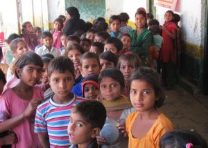 Children waiting to receive vaccinations in the northern Indian state of Uttar Pradesh. The measles vaccine saved an estimated 57 million lives between 2000 and 2022. : Alan Janssen, MSPH Public domain 